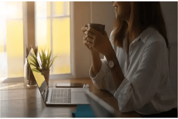 a woman in front of her laptop